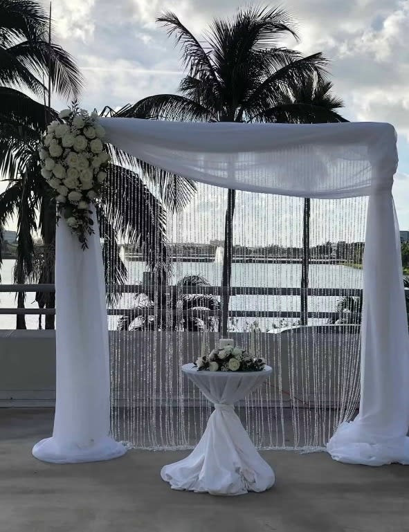 Wedding arch and altar flowers by Tropical Arrangements, Randallstown MD