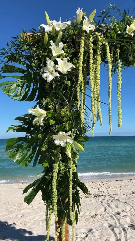 Wedding arch and altar flowers by Tropical Arrangements, Randallstown MD