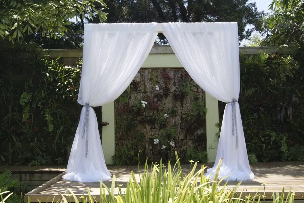 Wedding arch and altar flowers by Tropical Arrangements, Randallstown MD
