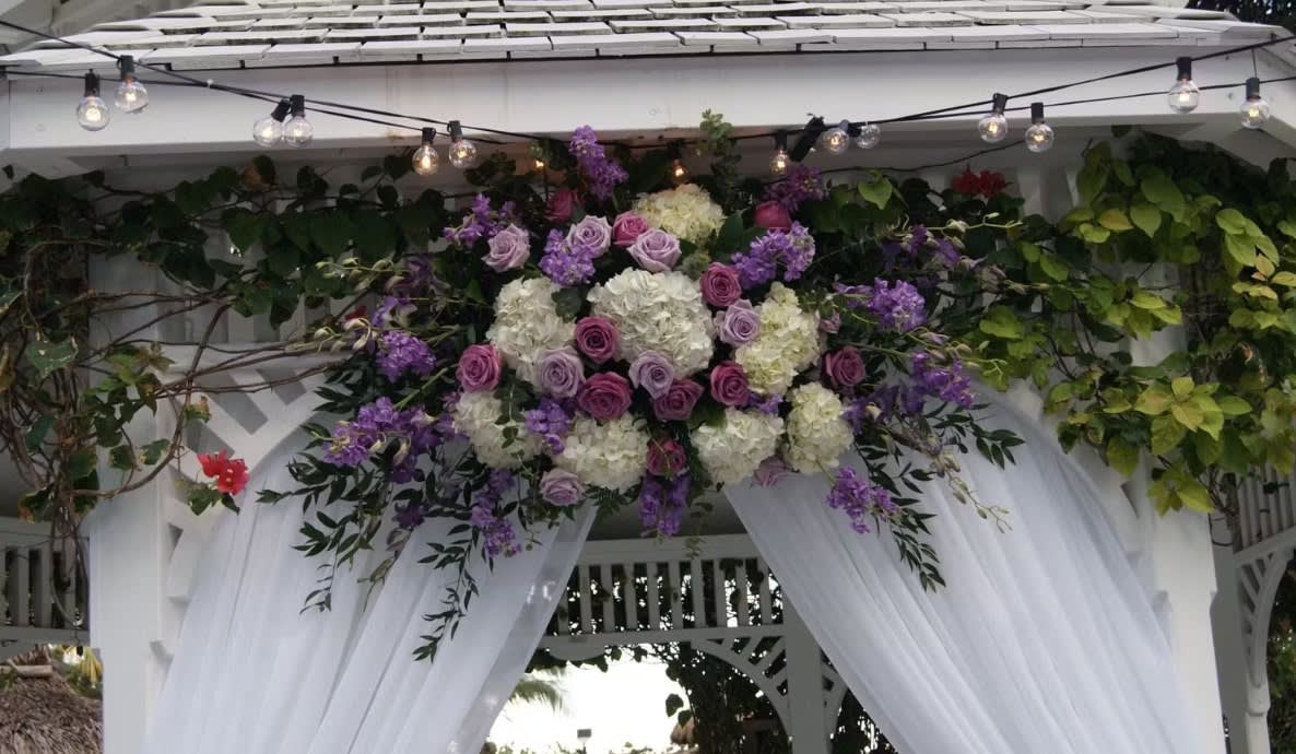 Wedding arch and altar flowers by Tropical Arrangements, Randallstown MD