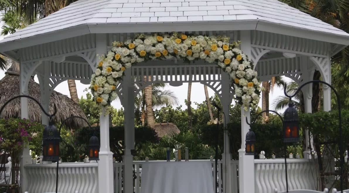 Wedding arch and altar flowers by Tropical Arrangements, Randallstown MD