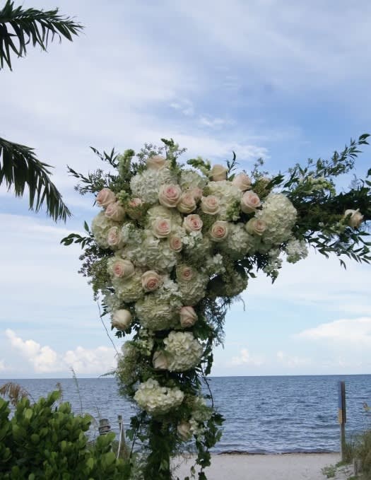 Wedding arch and altar flowers by Tropical Arrangements, Randallstown MD