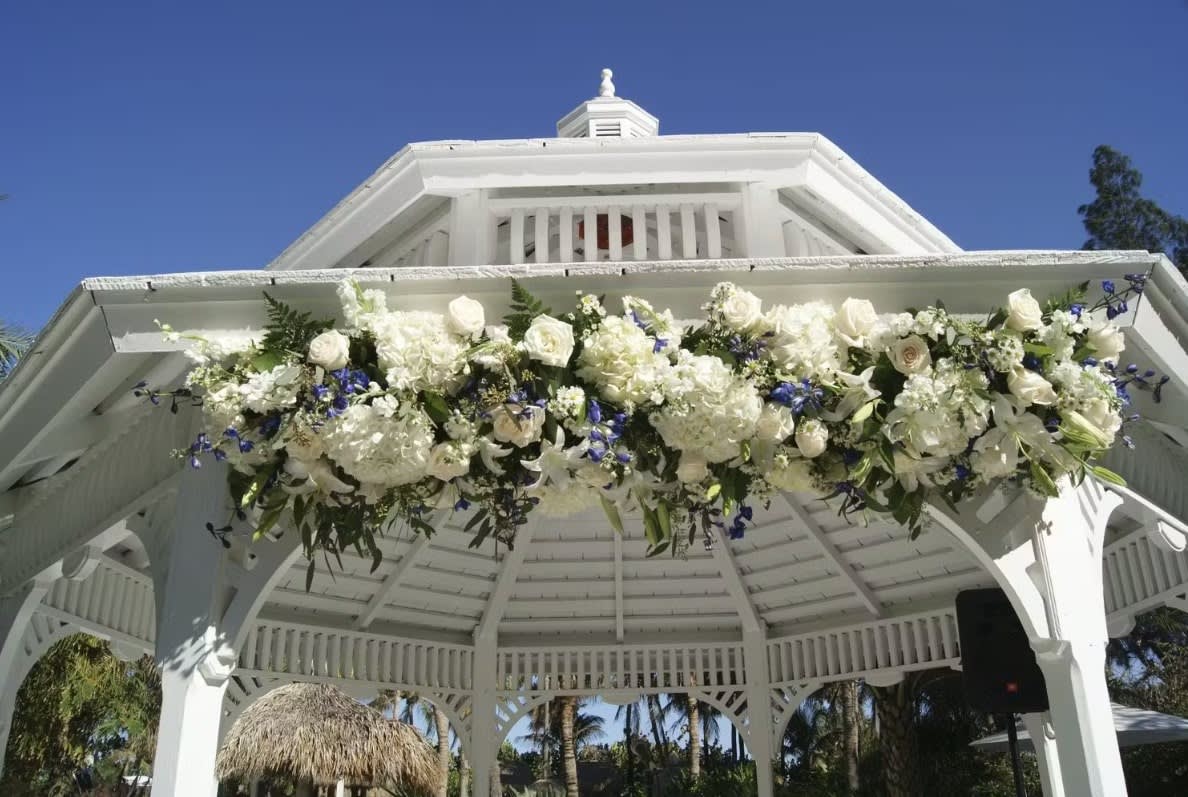 Wedding arch and altar flowers by Tropical Arrangements, Randallstown MD