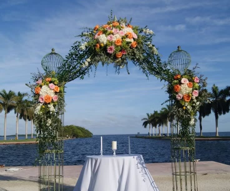 Wedding arch and altar flowers by Tropical Arrangements, Randallstown MD