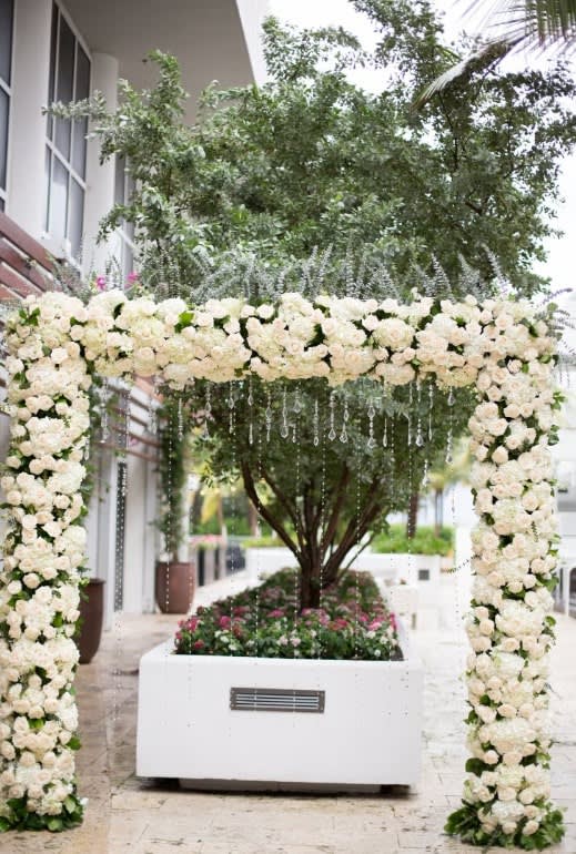 Wedding arch and altar flowers by Tropical Arrangements, Randallstown MD