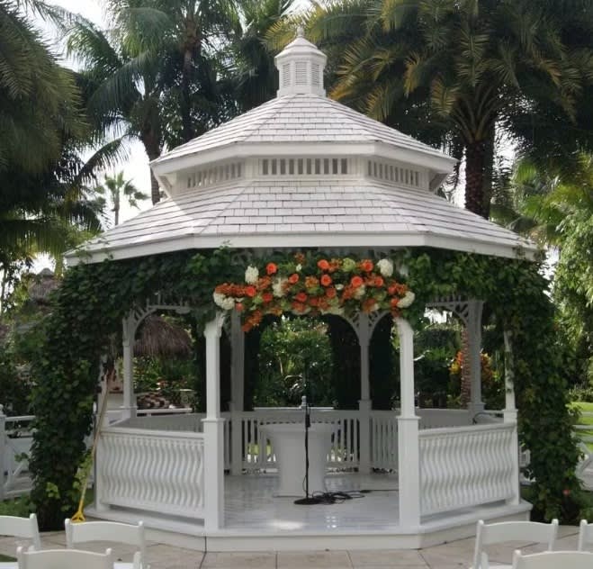 Wedding arch and altar flowers by Tropical Arrangements, Randallstown MD