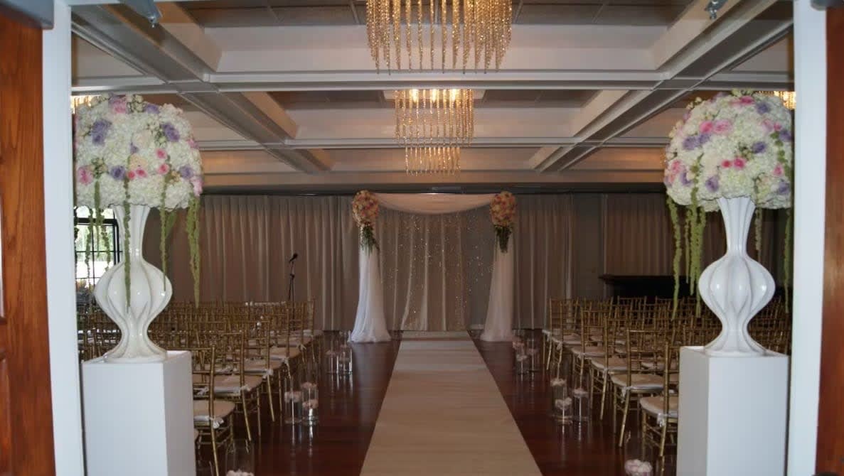 Wedding arch and altar flowers by Tropical Arrangements, Randallstown MD
