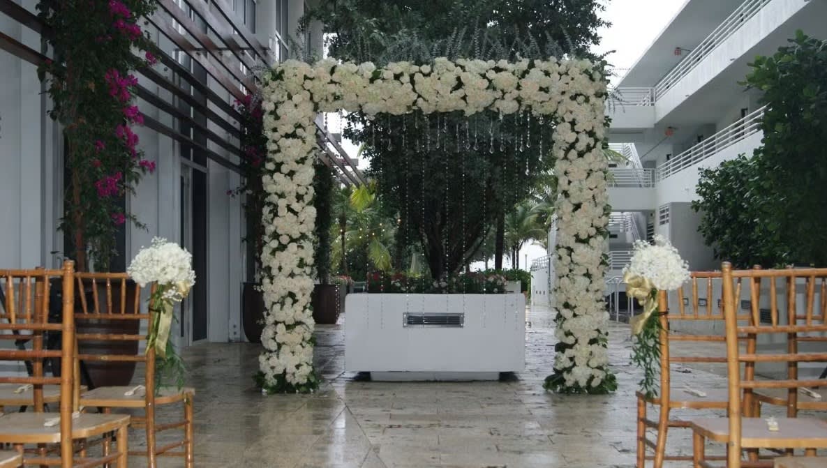 Wedding arch and altar flowers by Tropical Arrangements, Randallstown MD