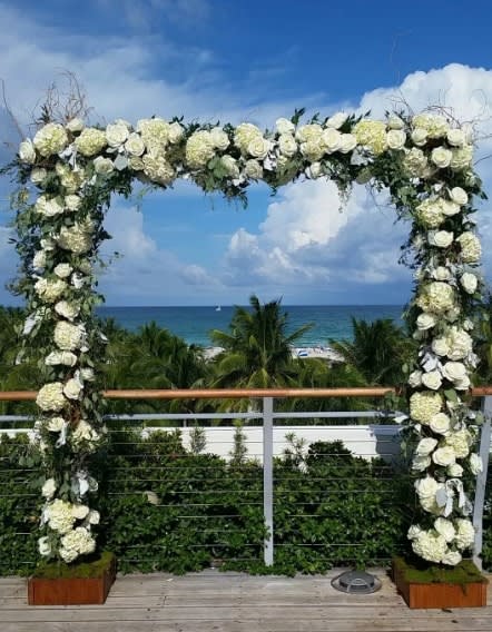 Wedding arch and altar flowers by Tropical Arrangements, Randallstown MD