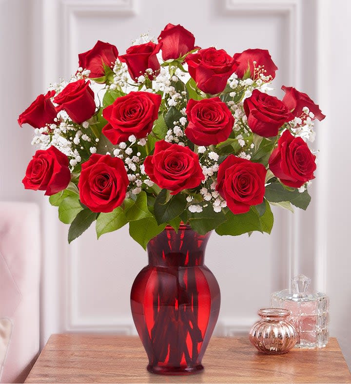RED ROSES AND RED VASES