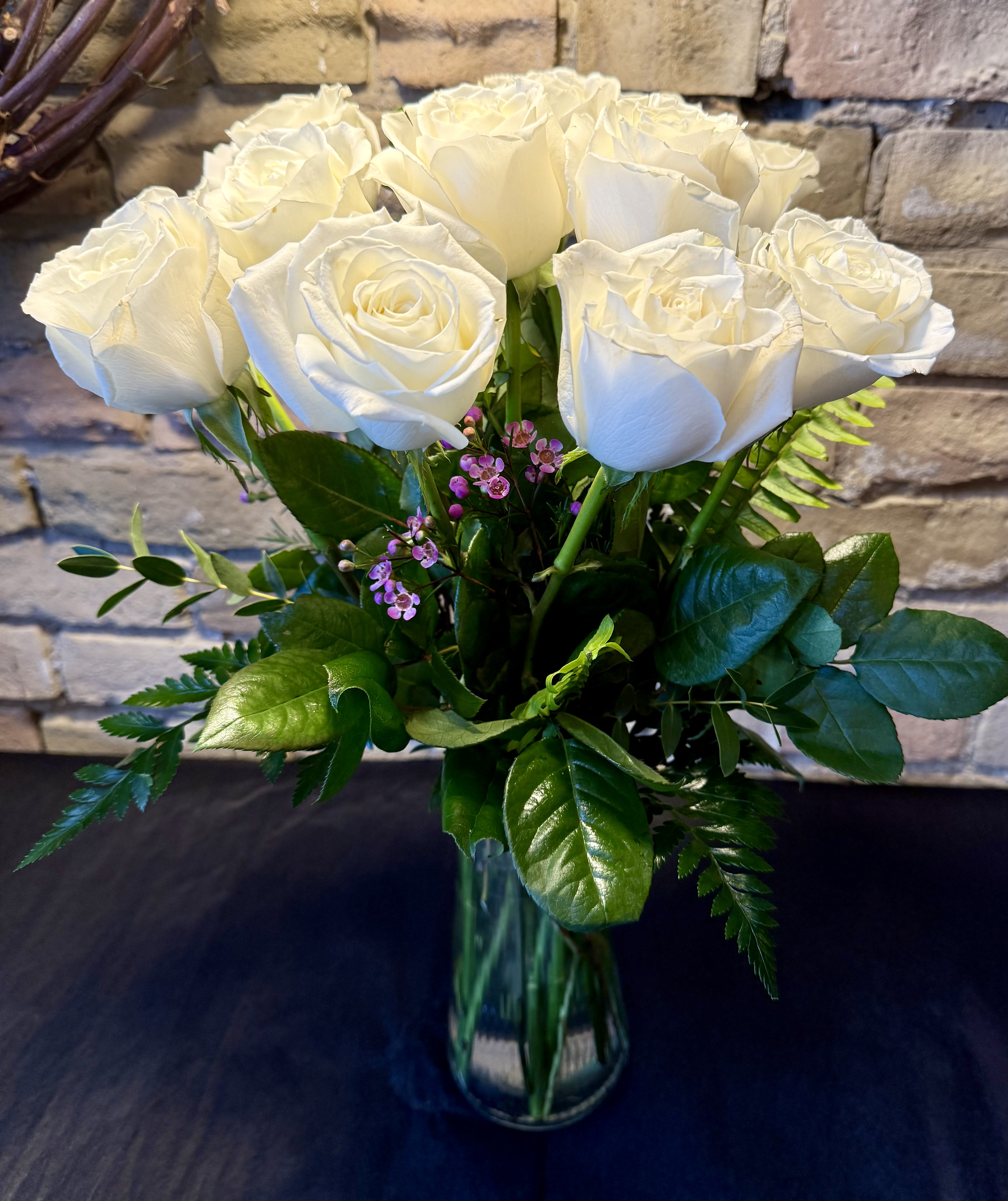 12 premium long stem white roses in a vase