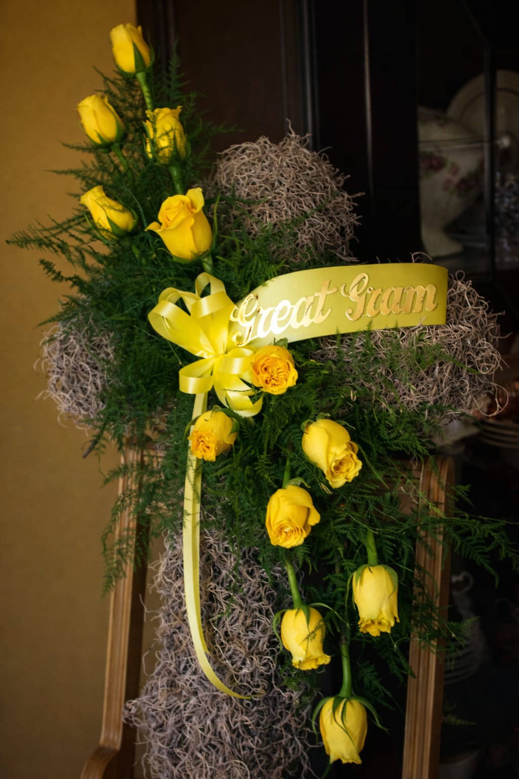 Moss Cross with Dozen Yellow Roses
