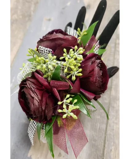 THREE BURGUNDY RANUCULUS