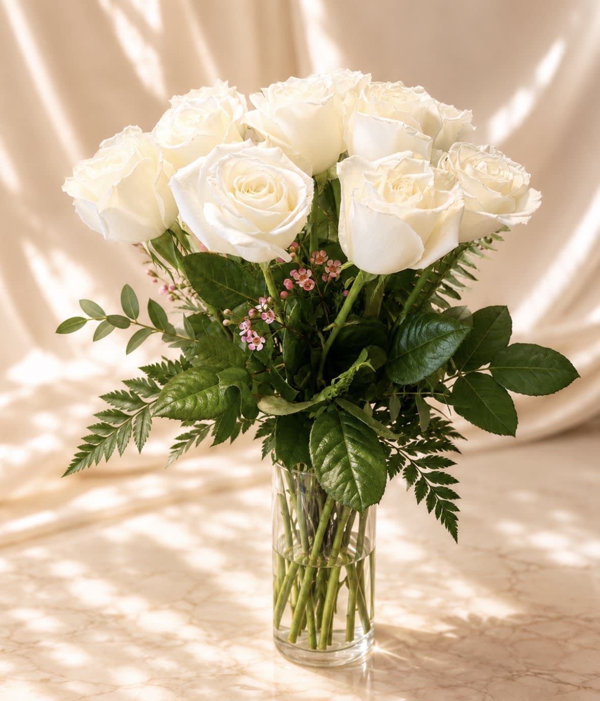 12 premium long stem white roses in a vase