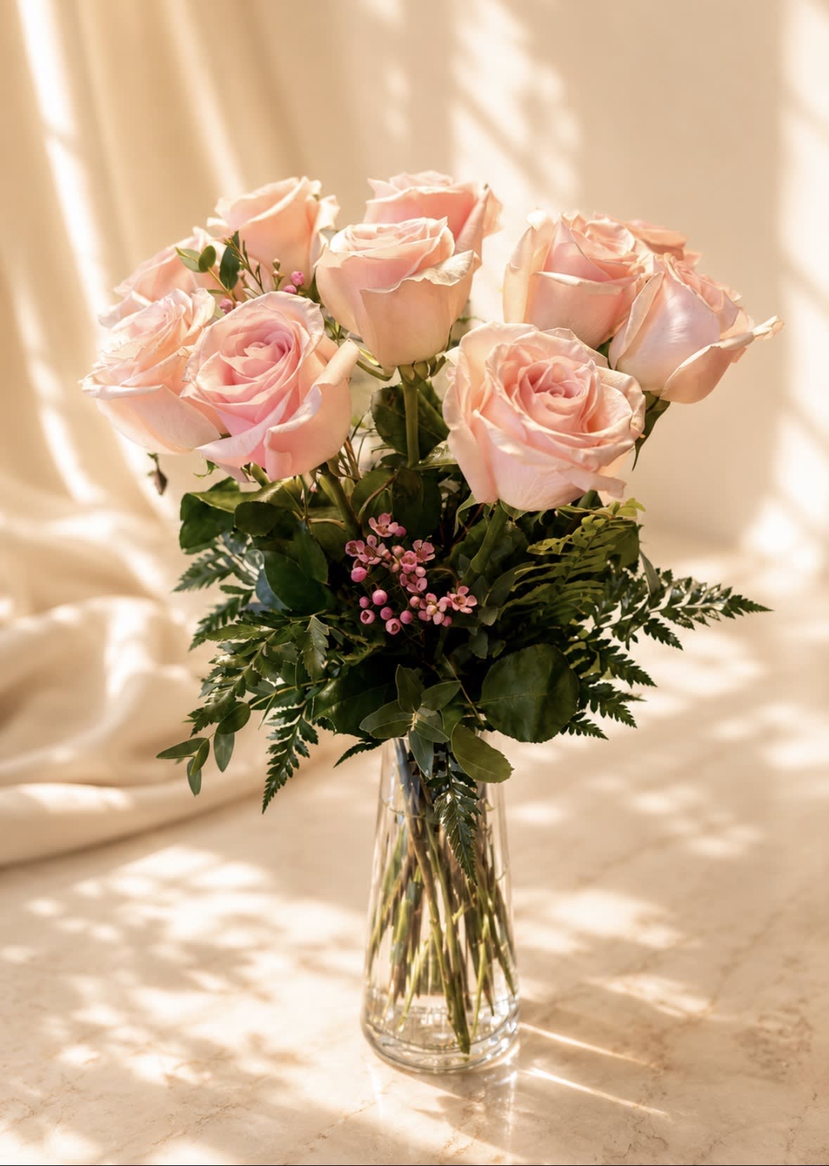 12 Premium long stem Pink Roses in a vase