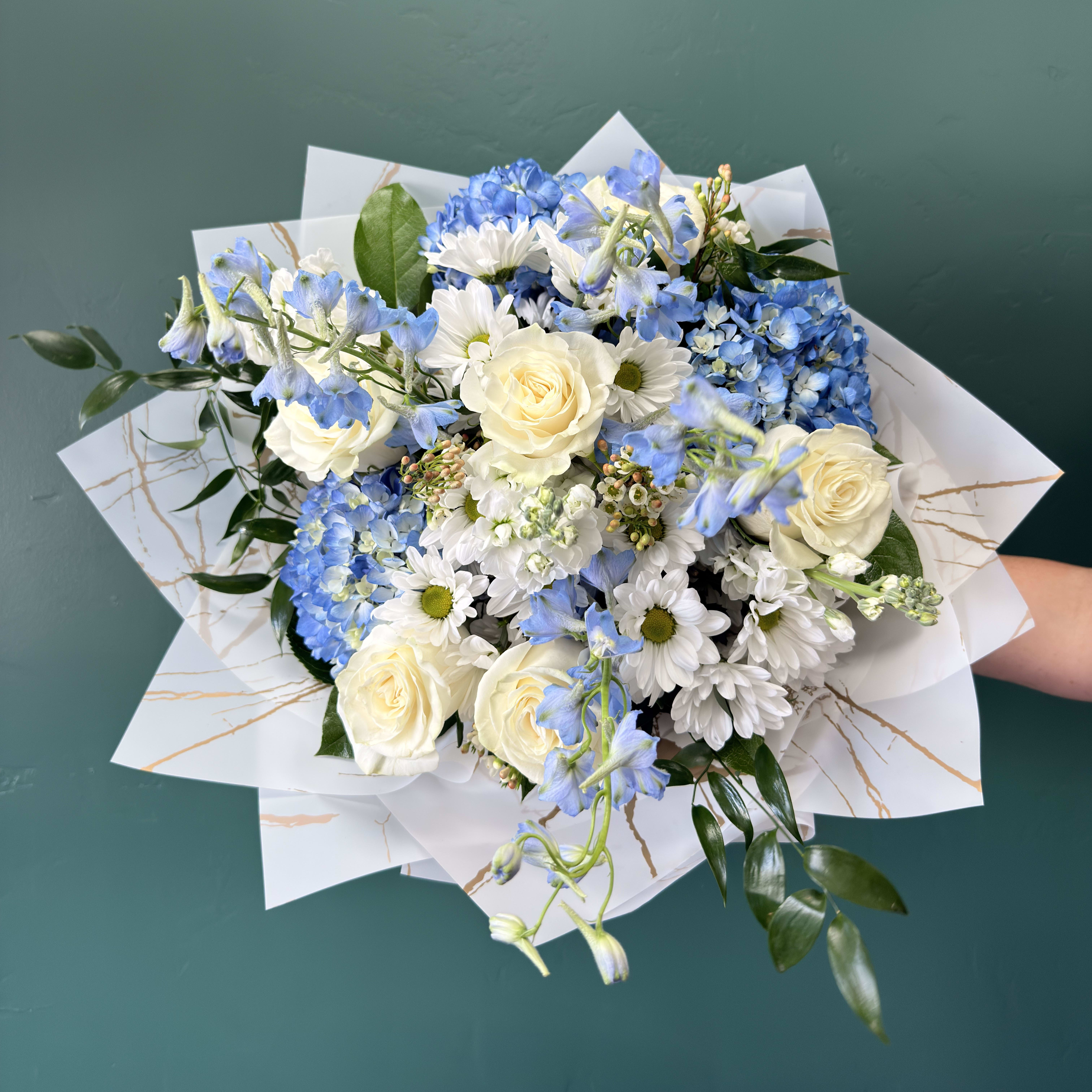 Shoreside Blooms Wrapped By Elite Flower Bouquet