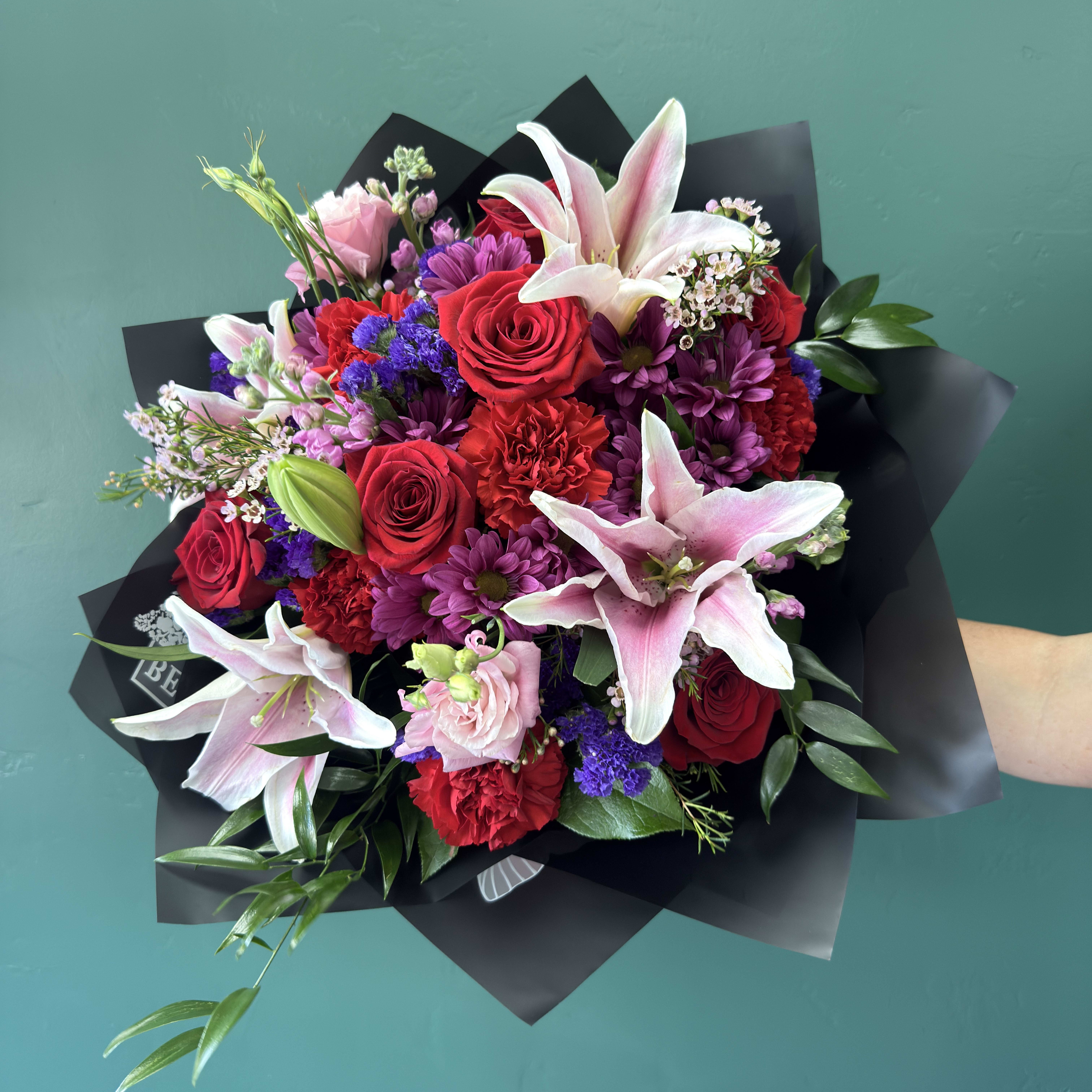 Romantic Antics Wrapped By Elite Flower Bouquet