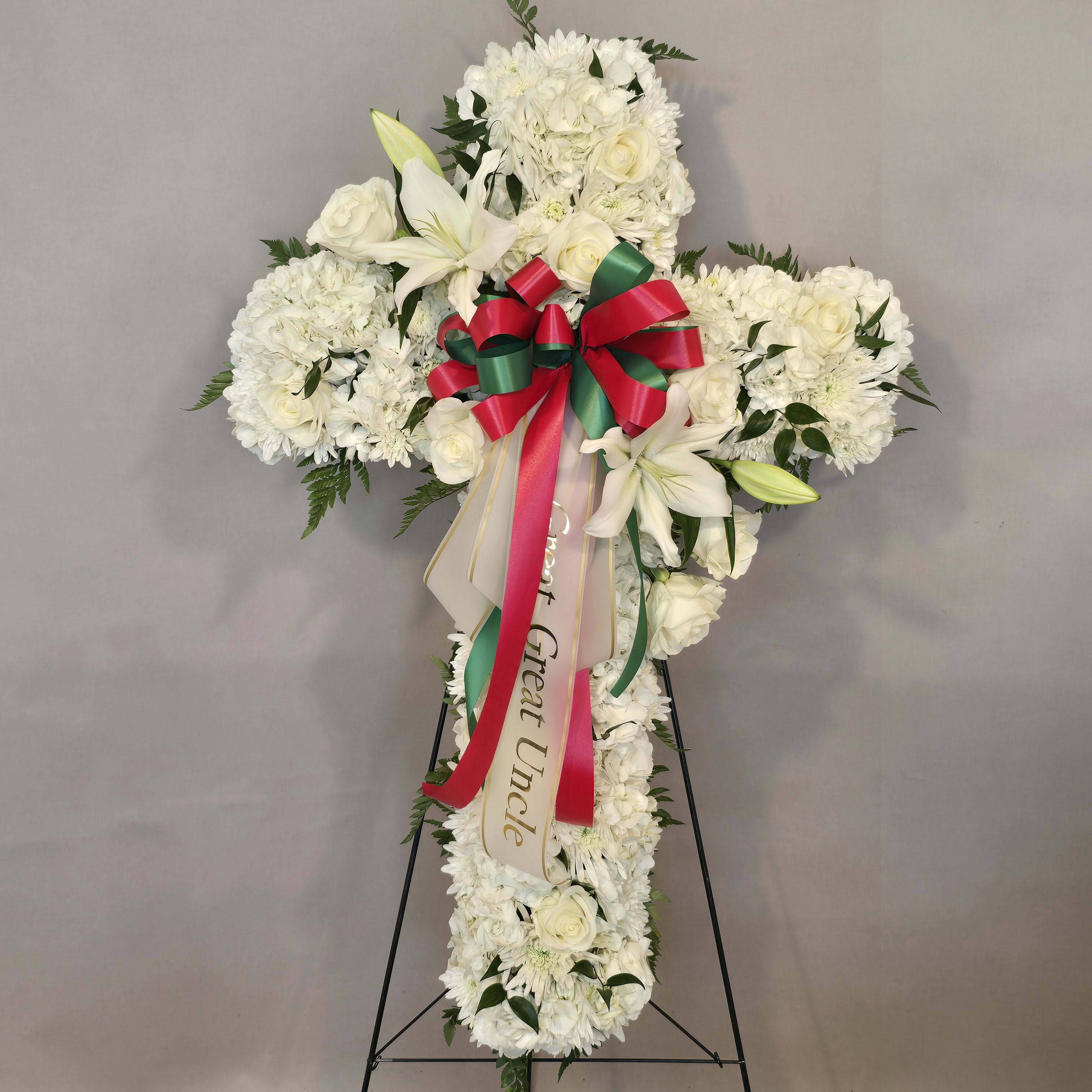 WHITE CROSS WITH GREEN AND RED BOW