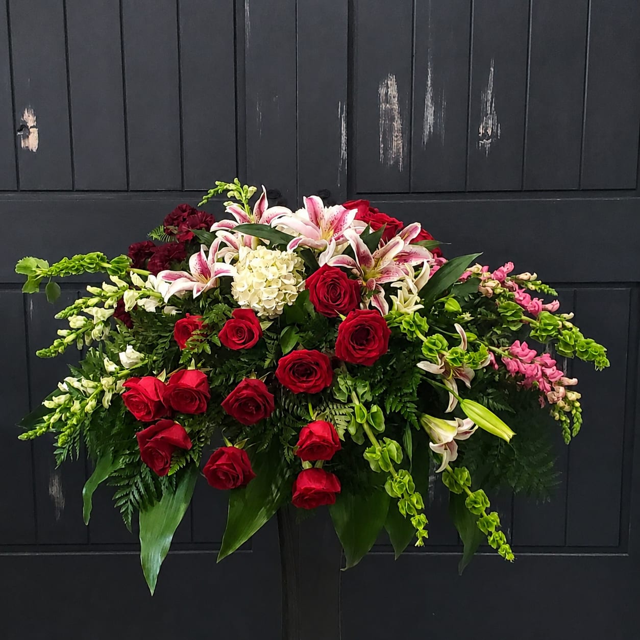 Elegant Adoration,  Roses and Lilies Casket Spray