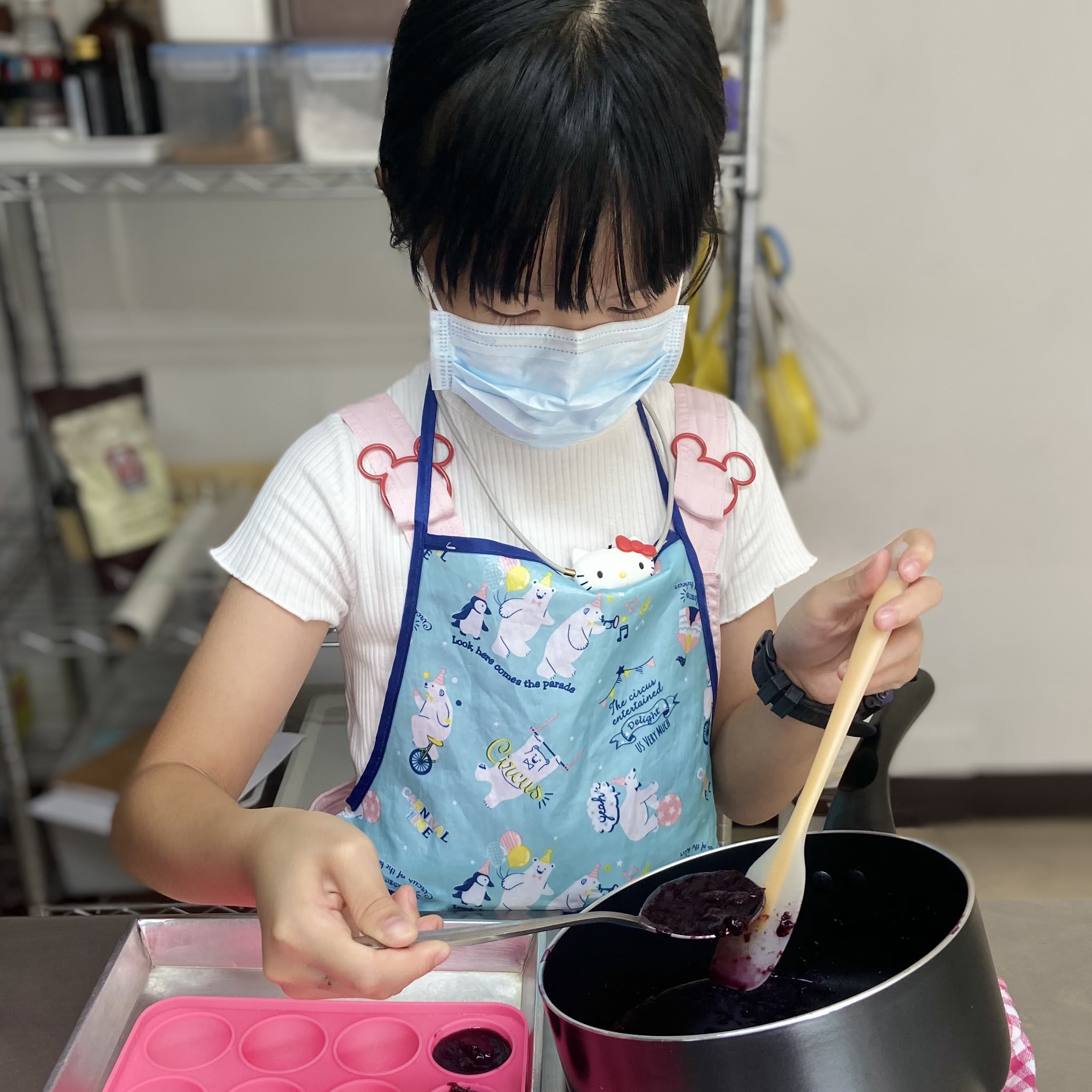 Kids learning to decorate cakes