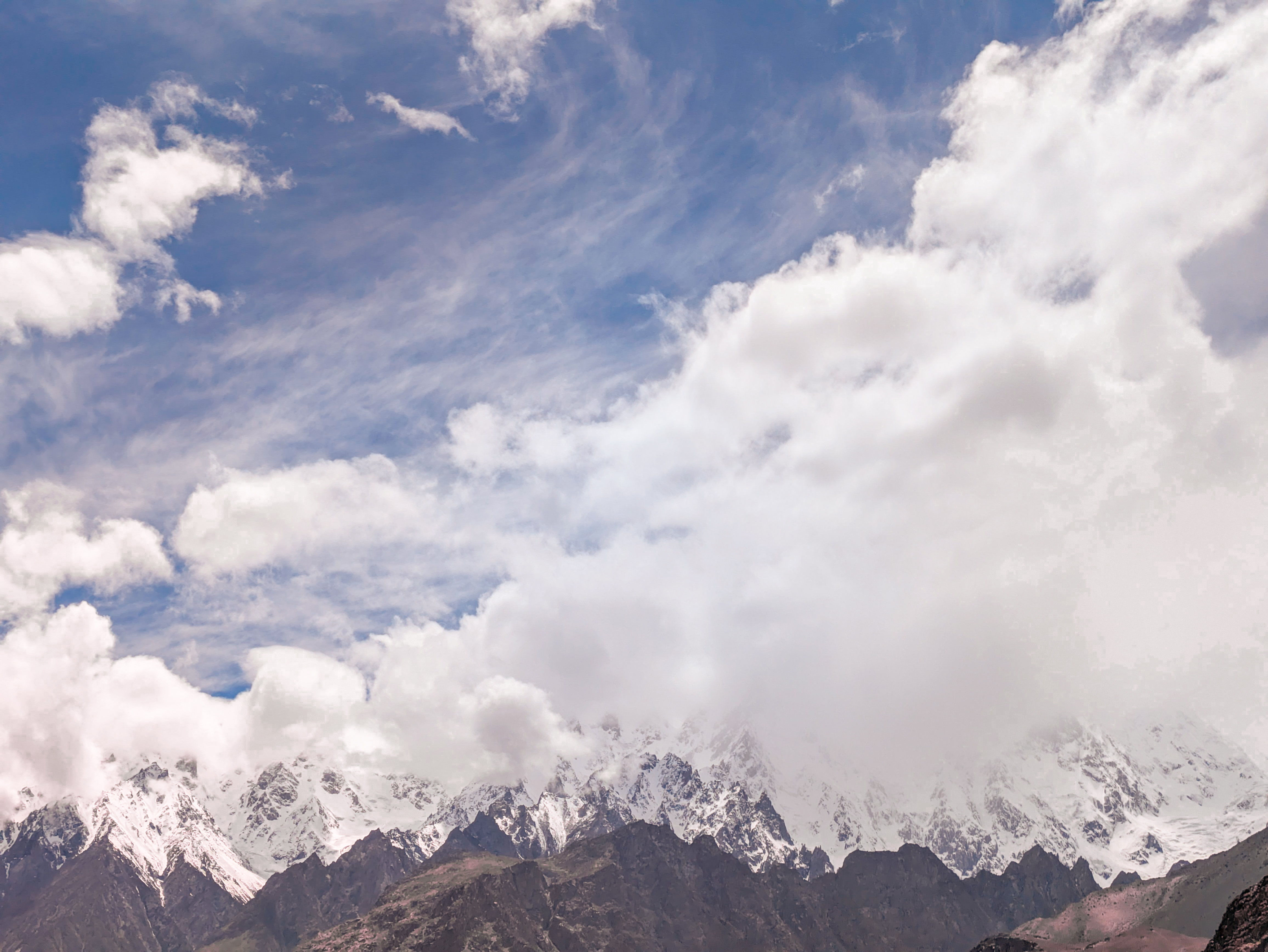 Mountain range beneath a cloudy sky