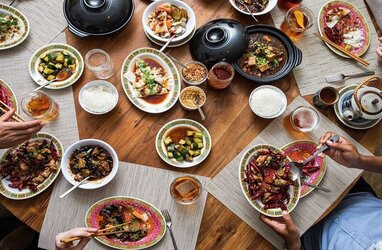 A side view of a plate of figs and berries.