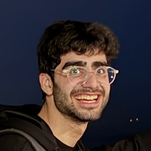 Close-up portrait showing Adil Al Qaba's face