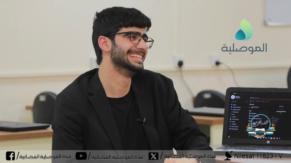 Adil smiling during interview with Al-Mosuliya TV