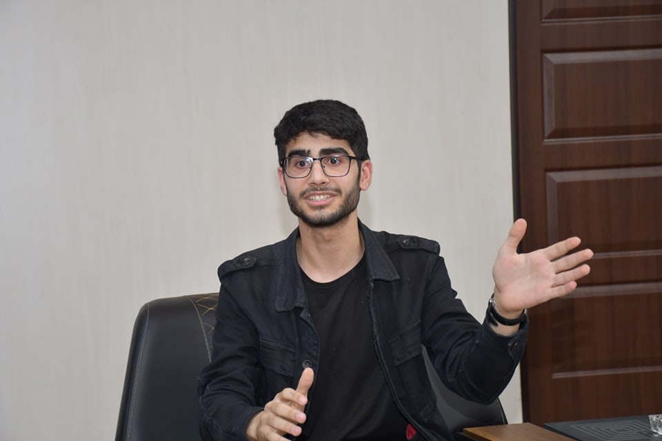 Adil talking during interview with Kossay Alahmady university president