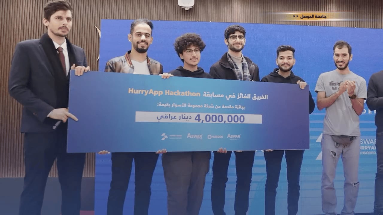 Winner team receiving prize cheque HurryApp Hackathon in Baghdad, Iraq