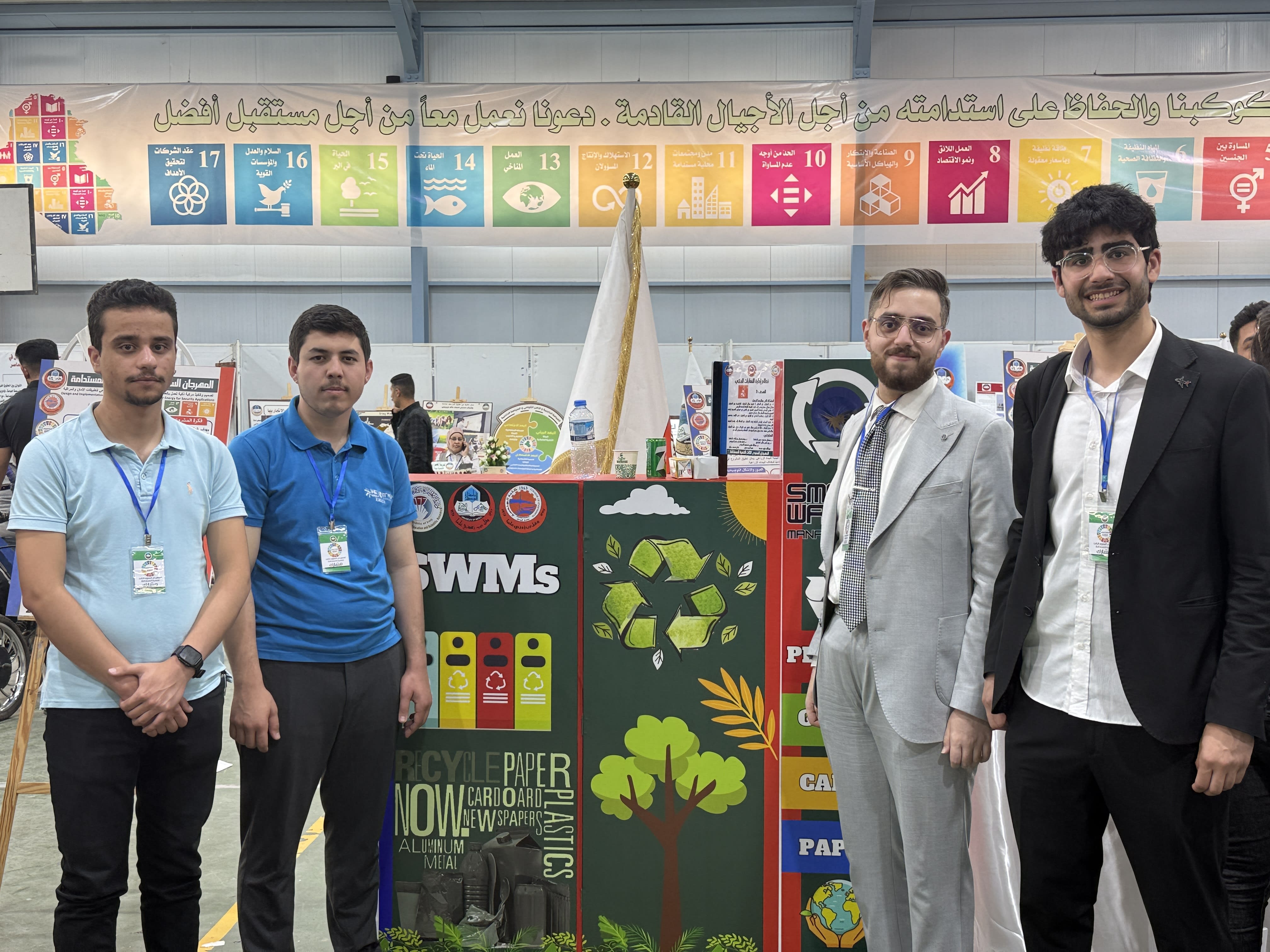 Team showcasing smart bin in sustainable development festival at University of Mosul