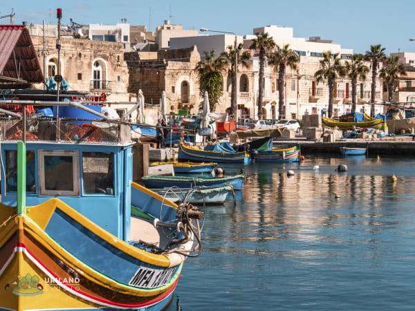 A traditional luzzu fishing boat moored at Marsaxlokk