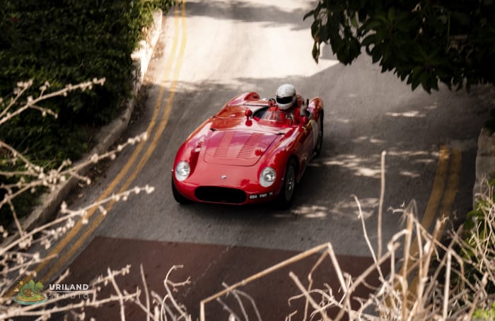 A pre-war classic car on the Mdina Grand Prix circuit, framed by the city's stone walls