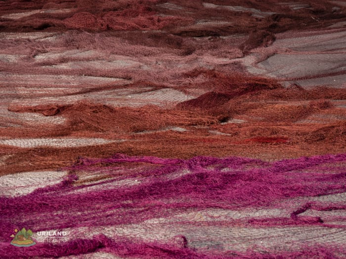 Fishing nets laid out on the ground at Marsaxlokk harbour