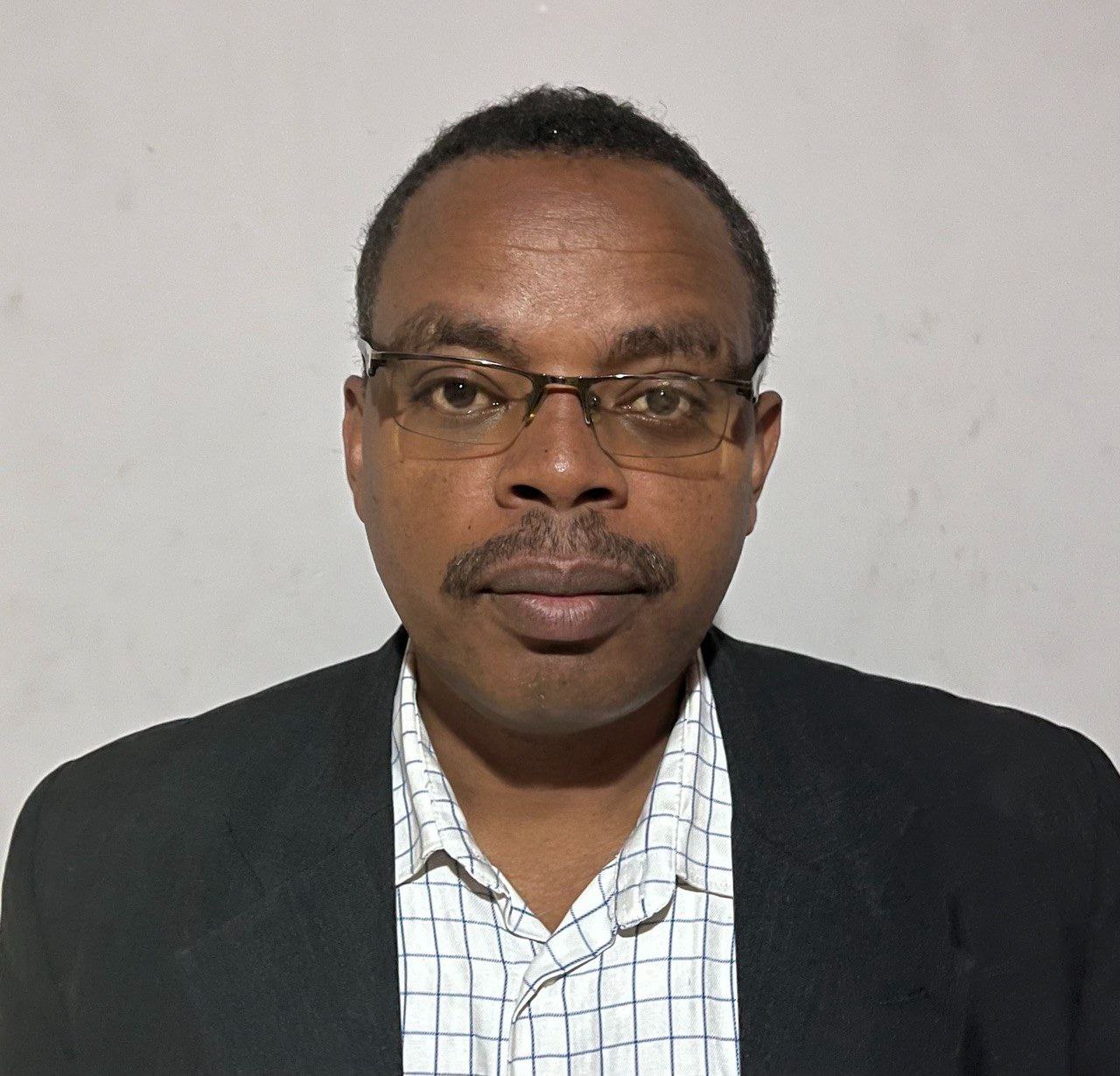 Dr. Achenef Kidane