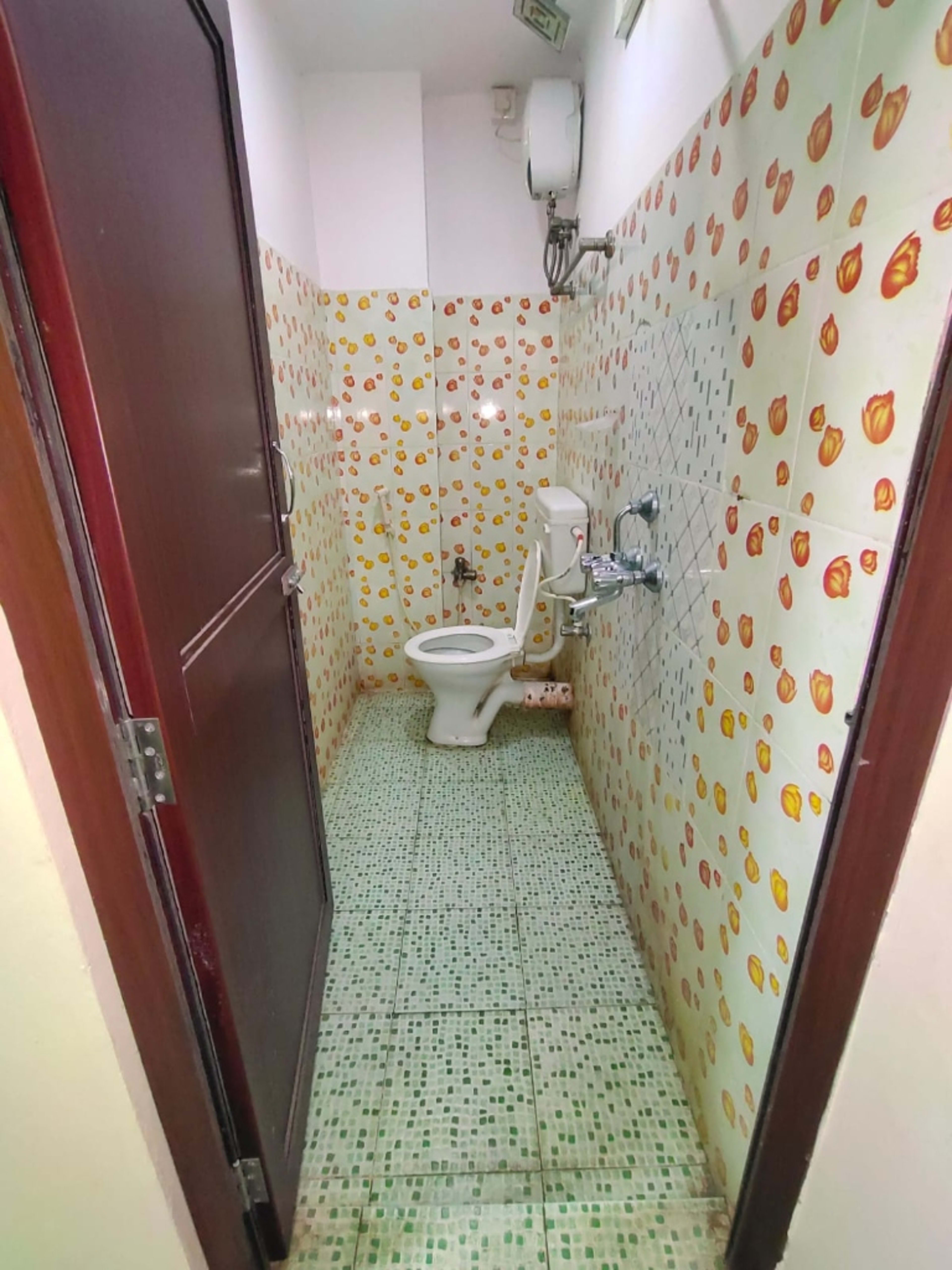Spacious layout with floral tiles, continuous water supply, and geyser facility.