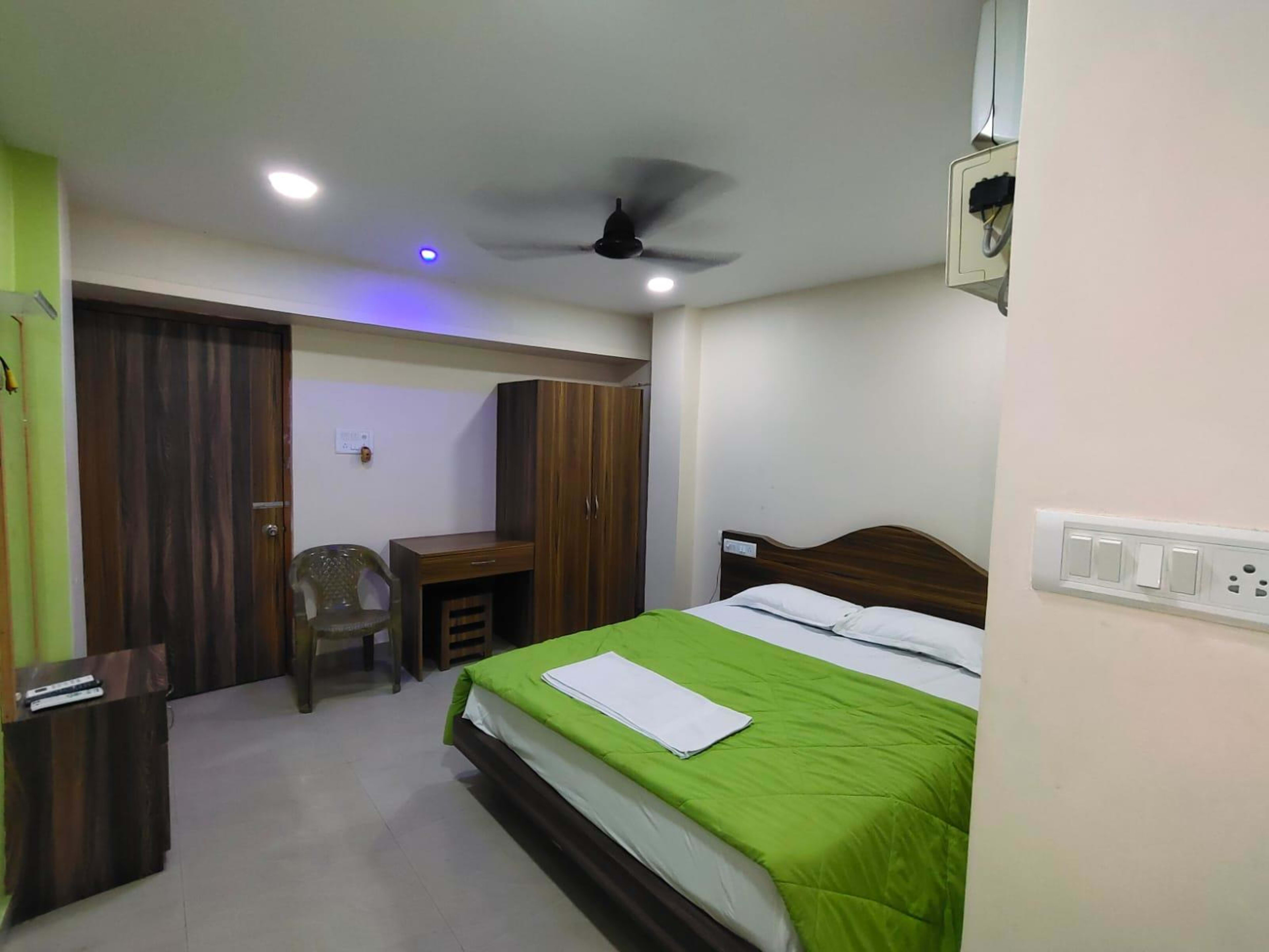 Clean double bedroom with split air conditioning and TV