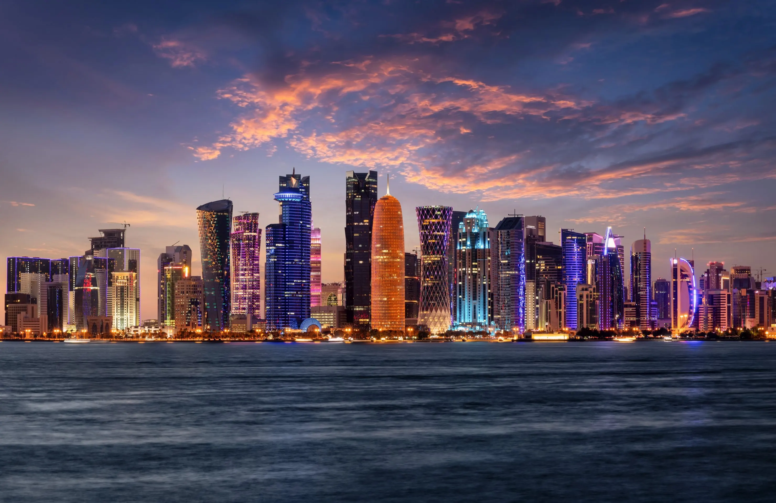 The stunning, modern skyline of Doha, Qatar at dusk.