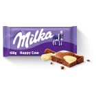 Milka – Czekolada mleczna Happy Cows to pokryta łatkami białej czekolady słodka przekąska.