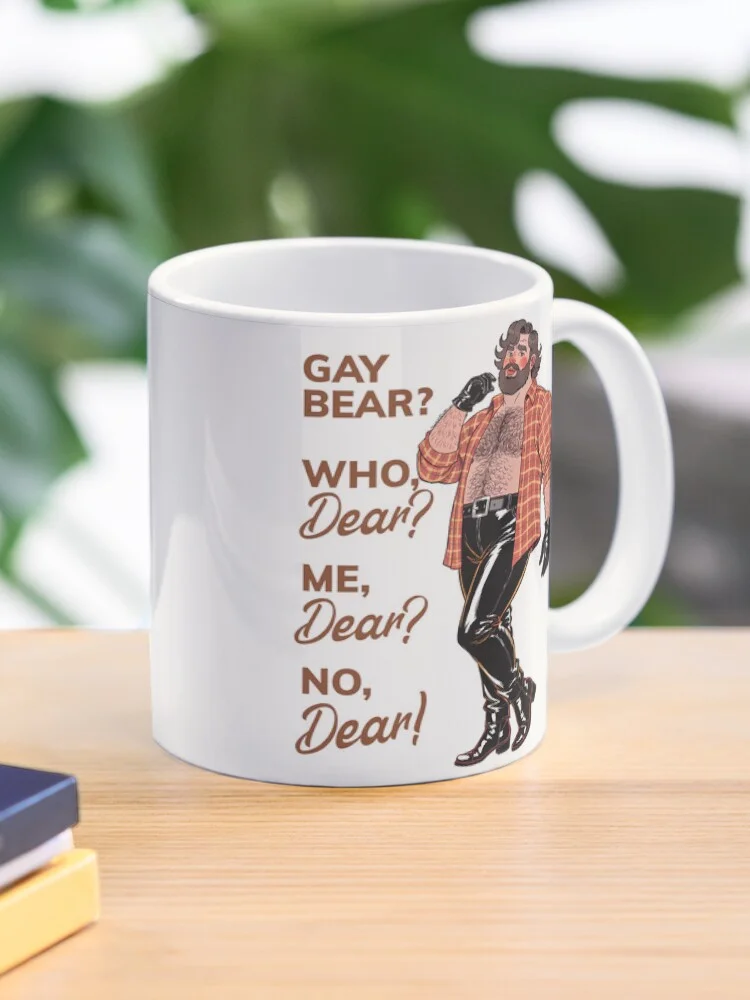 A white mug featuring the 'Gay Bear? Who, Dear? Me, Dear? No, Dear!' design. The cartoon bear character is printed on the mug.