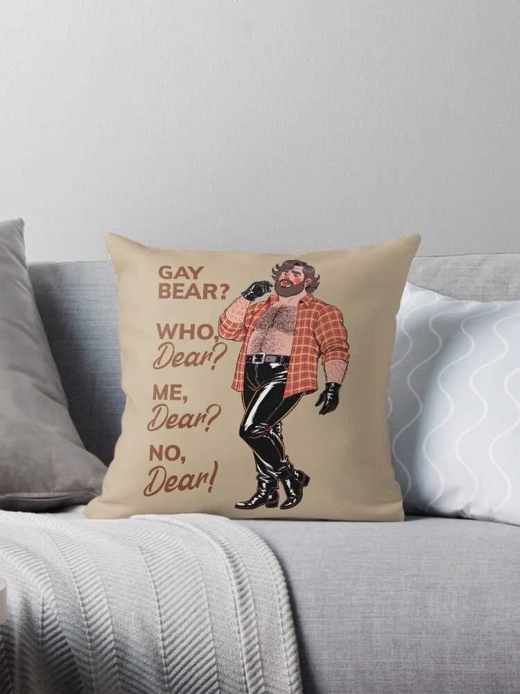 A beige throw pillow with the 'Gay Bear? Who, Dear? Me, Dear? No, Dear!' design. The cartoon bear character is printed on the pillow.