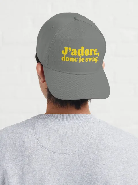 Grey baseball cap with the yellow text 'J'adore, donc je swag.'