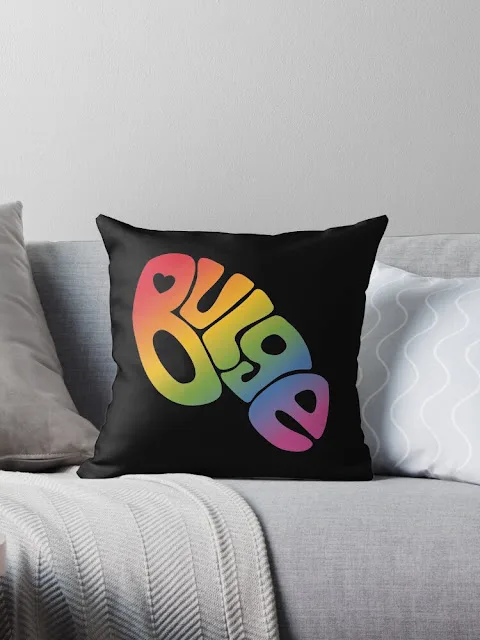Pride-colored Bulge text on a pillow.