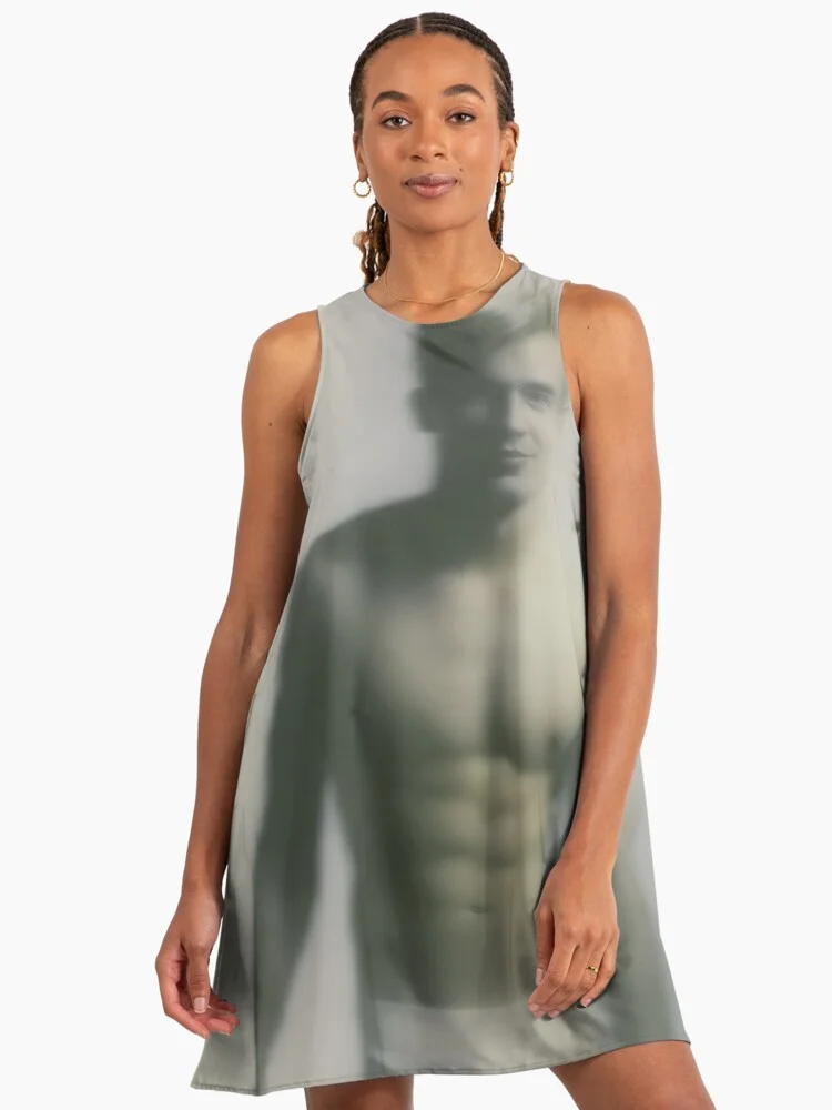 Model wearing a stylish A-line dress printed with the blurred male artwork