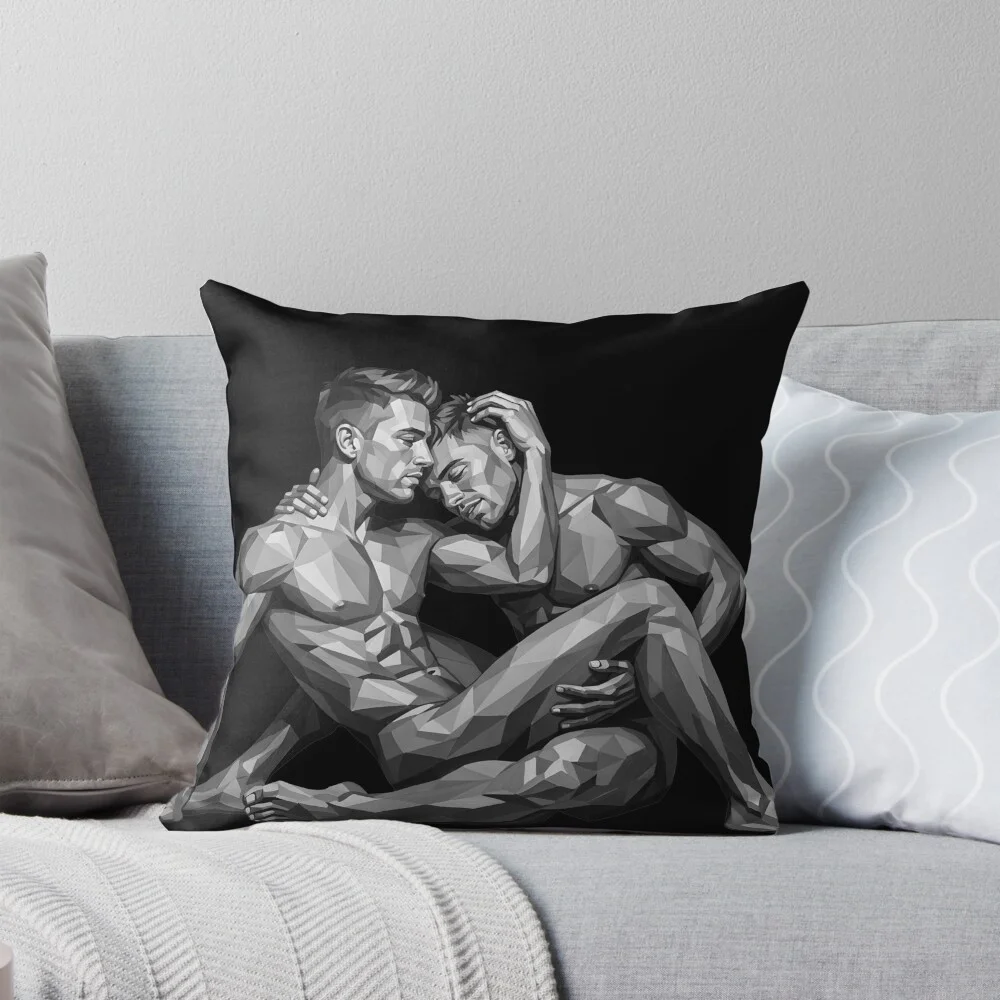 A plush throw pillow featuring the intimate monochrome design resting on a comfortable grey sofa.