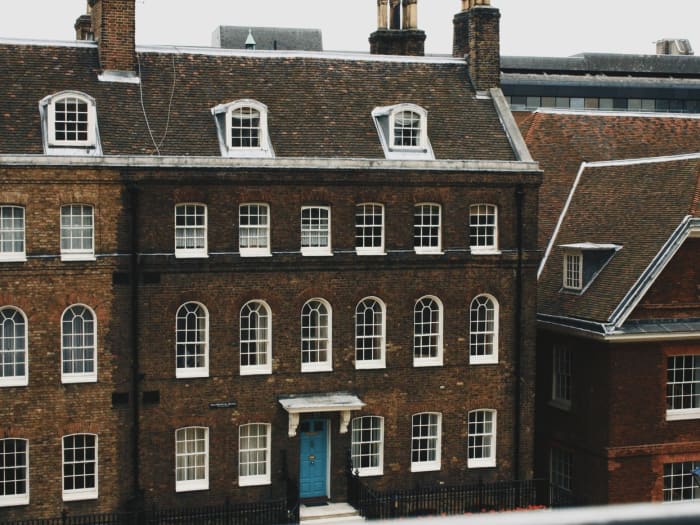 White timber sash windows on a Georgian brick terrace