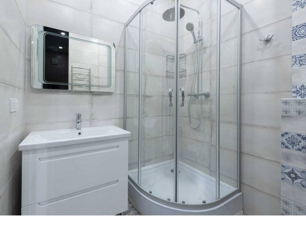 Curved glass shower enclosure in a modern Derby bathroom