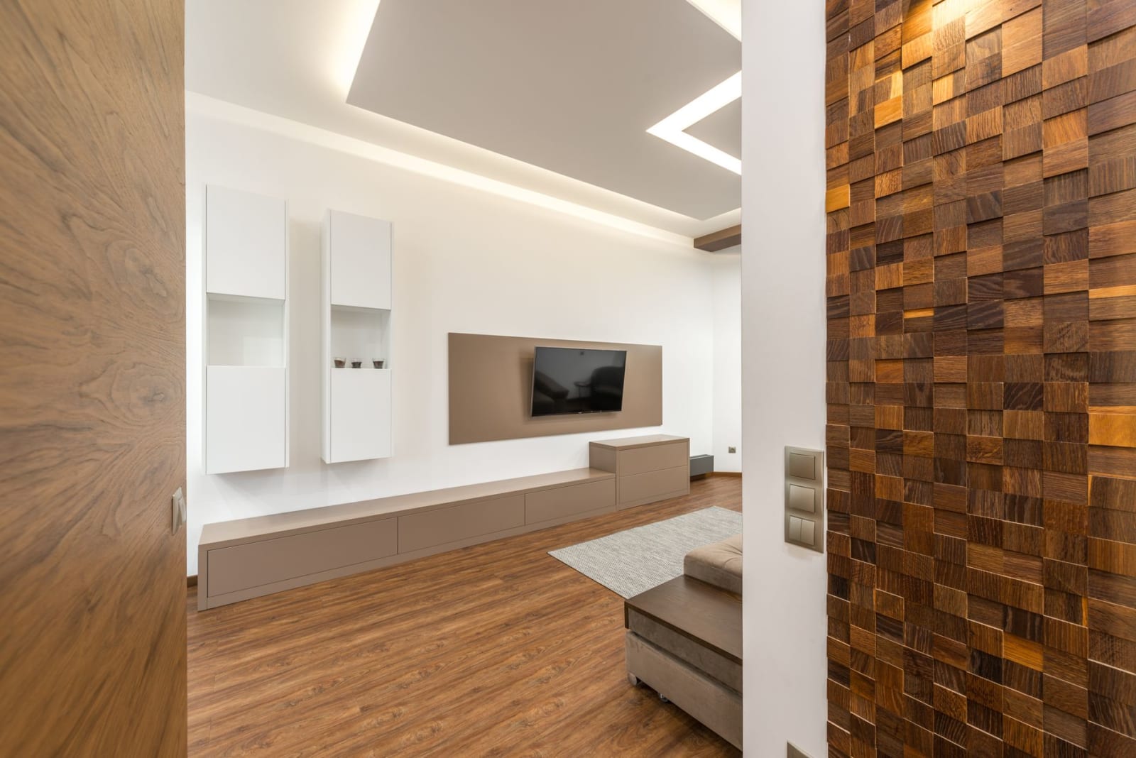 Modern living room media wall with recessed TV and wooden panelling