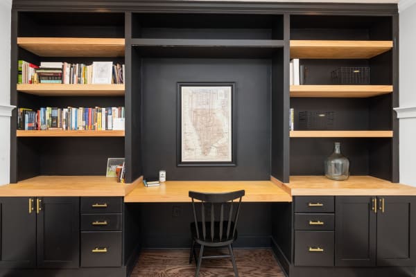 Home office with built-in desk and shelving