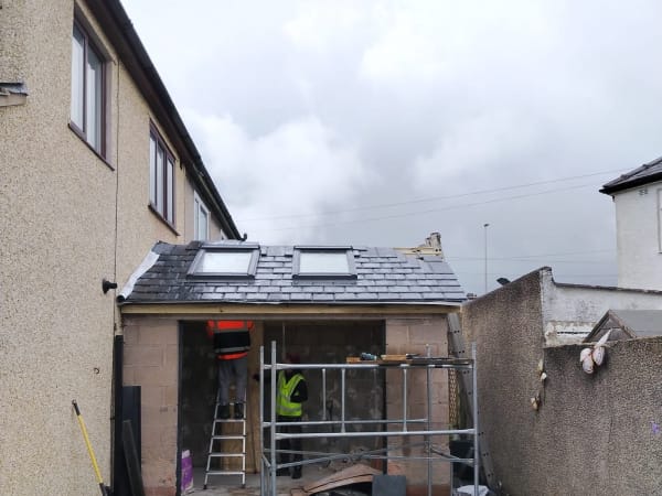 New tiled roof with two roof windows on a single storey rear extension in Carlisle